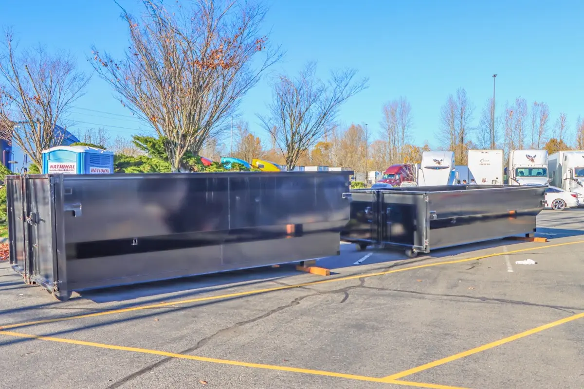 Professional dumpster rental service with roll-off container on residential driveway in Hilton Head Island